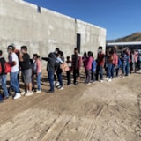 Families and children line up for Judah 1 outreach event