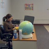 Teacher prepares lesson materials in a Juárez classroom