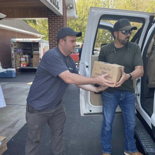 Volunteers unload medical supplies for Judah 1 mission relief